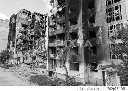 War in Ukraine - destroyed building in Borodyanka, black and white photo War in Ukraine - destroyed building in Borodyanka, black and white photo 90908408