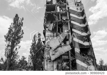 War in Ukraine - destroyed building in Borodyanka, black and white photo War in Ukraine - destroyed building in Borodyanka, black and white photo 90908420