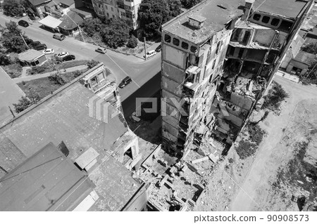 War in Ukraine - destroyed building in Borodyanka, black and white photo War in Ukraine - destroyed building in Borodyanka, black and white photo 90908573