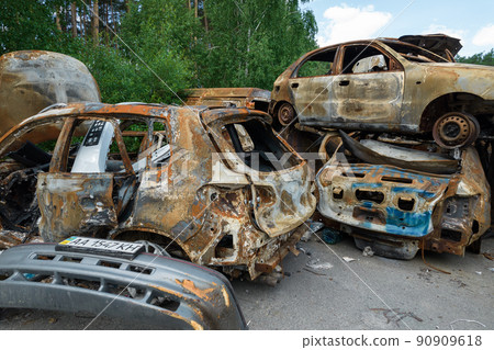 War-destroyed cars in Irpin, Bucha district, Ukraine War-destroyed cars in Irpin, Bucha district, Ukraine 90909618