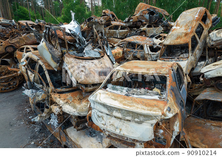 War-destroyed cars in Irpin, Bucha district, Ukraine 90910214