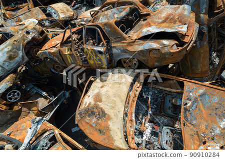 War in Ukraine: a dump of shot and burned cars in Irpin, Bucha district War in Ukraine: a dump of shot and burned cars in Irpin, Bucha district 90910284