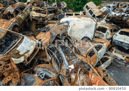 War-destroyed cars in Irpin, Bucha district, Ukraine War-destroyed cars in Irpin, Bucha district, Ukraine 90910450
