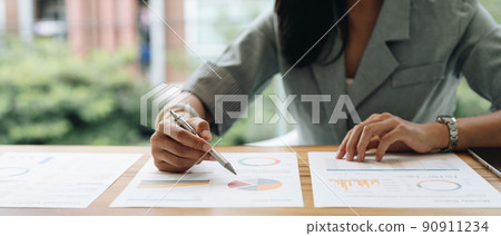 Close up business accounting Discussing with coworker planning analyzing financial document data charts and graphs Concept. Close up business accounting Discussing with coworker planning analyzing financial document data charts and graphs Concept. 90911234