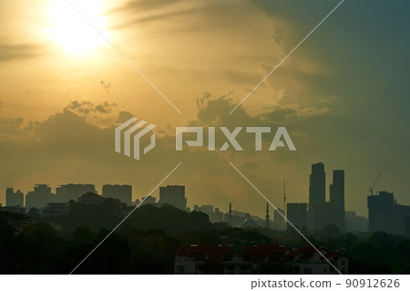sunset over cloudy foggy modern city a sunset over cloudy foggy modern city a 90912626