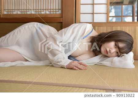 A young woman wearing a shirt in lingerie posing in a Japanese-style room in an old folk house A young woman wearing a shirt in lingerie posing in a Japanese-style room in an old folk house 90913022