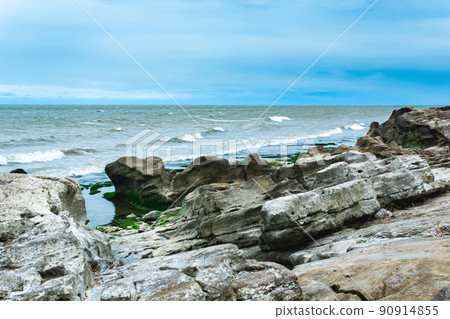 seascape, shore of the Caspian Sea with algae-covered coastal stones seascape, shore of the Caspian Sea with algae-covered coastal stones 90914855