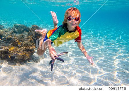 Child snorkeling. Kids underwater. Beach and sea. Child snorkeling. Kids underwater. Beach and sea. 90915756