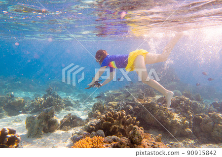 Child snorkeling. Kids underwater. Beach and sea. Child snorkeling. Kids underwater. Beach and sea. 90915842
