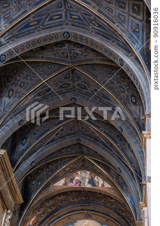 arched ceiling with painting in old catholic church in italy 90916036