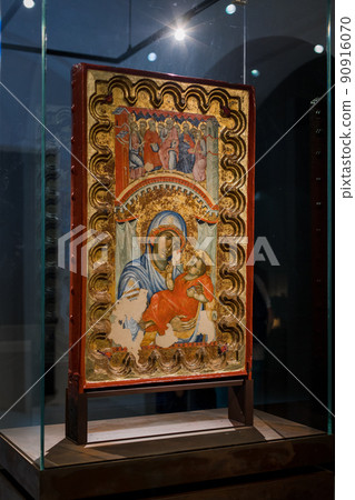 antique religious catholic icon in a museum behind glass in italy 90916070