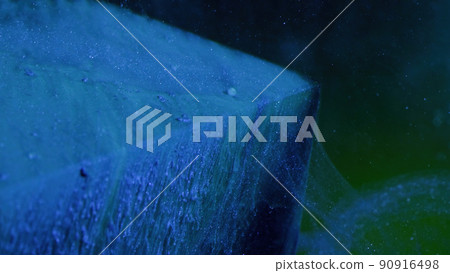 Ink water drip. Ice waterfall. Frozen cascade. Neon blue color glitter bubble paint on cube edge angle in mist cloud texture on green abstract art background. Ink water drip. Ice waterfall. Frozen cascade. Neon blue color glitter bubble paint on cube edge angle in mist cloud texture on green abstract art background. 90916498