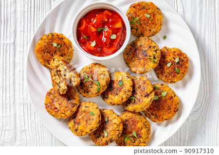 cauliflower patties on plate with tomato sauce cauliflower patties on plate with tomato sauce 90917310