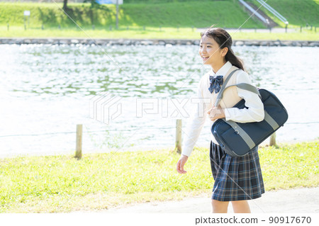 A junior high school girl in uniform who goes to school A junior high school girl in uniform who goes to school 90917670