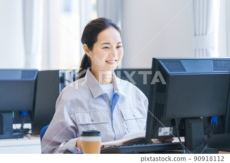 Young engineer typing on a computer Shooting cooperation: Japanese language school attached to Chuo Technical School Young engineer typing on a computer Shooting cooperation: Japanese language school attached to Chuo Technical School 90918112