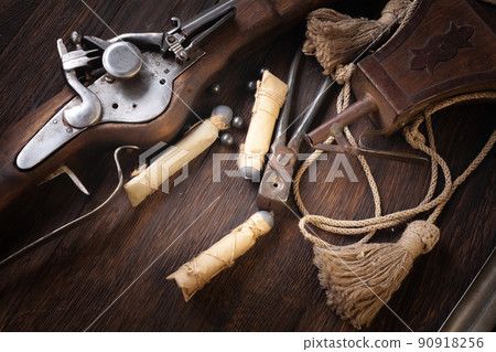 17th century ancient flintlock musket with powder flask and led bullets. 17th century ancient flintlock musket with powder flask and led bullets. 90918256