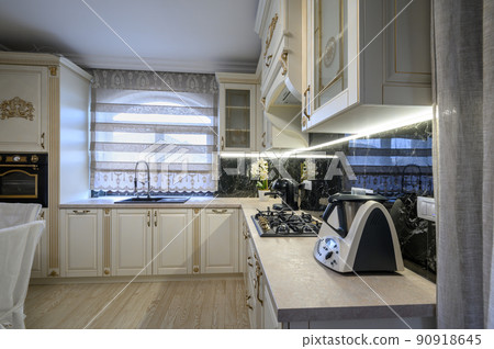 White classic cozy kitchen and dining room in city house White classic cozy kitchen and dining room in city house 90918645