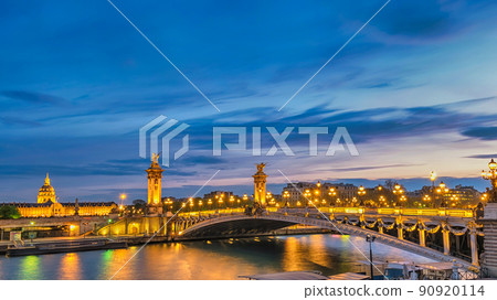 Paris France night city skyline at Seine River with Pont Alexandre III bridge 90920114