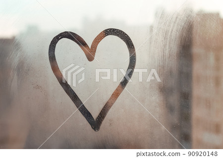 Doodle heart painted on glass wet blu window at home Doodle heart painted on glass wet blu window at home 90920148