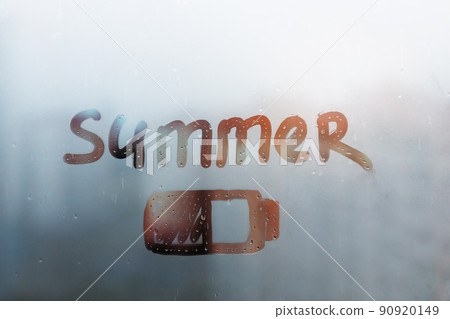 Hand drawn orange shape battery and word summer on muddy glass wet orange window in city on sunset 90920149
