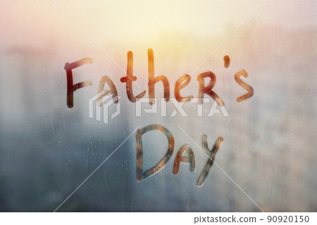 Handwritten text Fathers day written finger on orange sunset wet window 90920150