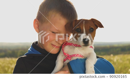 little child hugs dog smiles. portrait kid boy. dog human friendship concept. chidhood dream. happy family. cheerful happy child hugging little puppy. pet dog puppy. play game dog. son boy having fun. little child hugs dog smiles. portrait kid boy. dog human friendship concept. chidhood dream. happy family. cheerful happy child hugging little puppy. pet dog puppy. play game dog. son boy having fun. 90920165