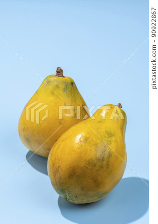 Ripe yellow papaya on a refreshing blue background 90922867