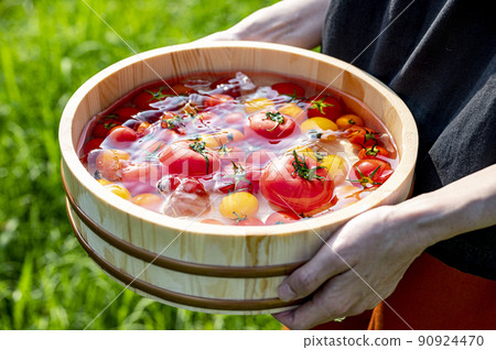 Fresh tomatoes chilled in water 90924470