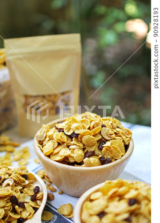 Close up honey caramel cornflakes with raisins and cashews Close up honey caramel cornflakes with raisins and cashews 90928193