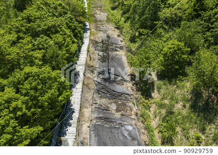 Aerial view of Toya Nishiyama foot crater (faulted road) Aerial view of Toya Nishiyama foot crater (faulted road) 90929759
