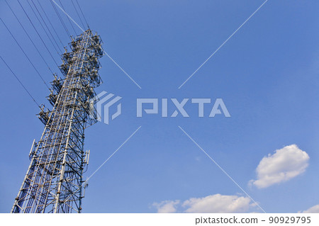 Steel tower standing against the blue sky Steel tower standing against the blue sky 90929795