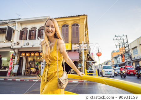 Woman tourist on the Street in the Portugese style Romani in Phuket Town. Also called Chinatown or the old town Woman tourist on the Street in the Portugese style Romani in Phuket Town. Also called Chinatown or the old town 90931159