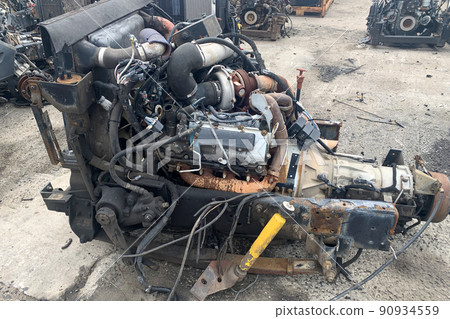 Closeup of truck engine for recycling, motor of crashed automobile in junkyard, spare part for truck lorries. 90934559