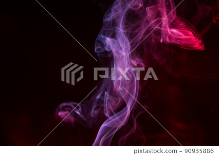 Colorful smoke close-up on a black background Colorful smoke close-up on a black background 90935886