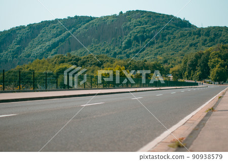 Road leading to German National Park Eifel 90938579