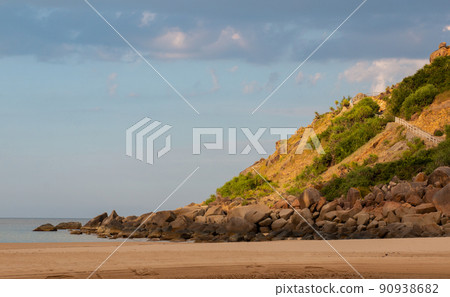 The stone coast of Vietnam. Large boulders on the beach. 90938682