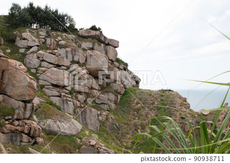 The stone coast of Vietnam. Large boulders on the beach. The stone coast of Vietnam. Large boulders on the beach. 90938711
