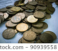 Ukrainian coins lie in a pile on documents 90939558