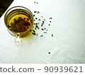Shot of pouring tea on white background in glass cup 90939621