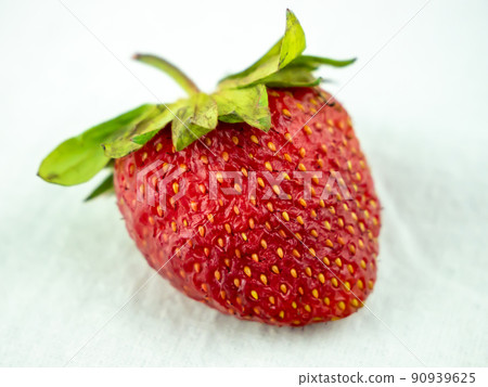 Single fresh strawberry lay on white background Single fresh strawberry lay on white background 90939625