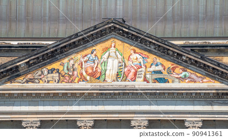 Building of the Ministry of the state capital of Saxony, Ministry of Finance, with old roof mosaic painting of historical state scenes, Dresden, Germany. Building of the Ministry of the state capital of Saxony, Ministry of Finance, with old roof mosaic painting of historical state scenes, Dresden, Germany. 90941361