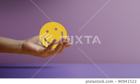 Positive Mind, Enjoying Life Concept. Hand Holding a Smiling Face Paper. Sign of Mental Health, Wellbeing and Healthy Lifestyles. Happy Client giving Positive Review and Feedback Positive Mind, Enjoying Life Concept. Hand Holding a Smiling Face Paper. Sign of Mental Health, Wellbeing and Healthy Lifestyles. Happy Client giving Positive Review and Feedback 90941522