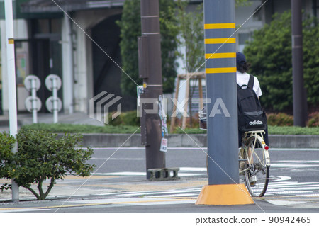 High school girl who goes to school by bicycle High school girl who goes to school by bicycle 90942465