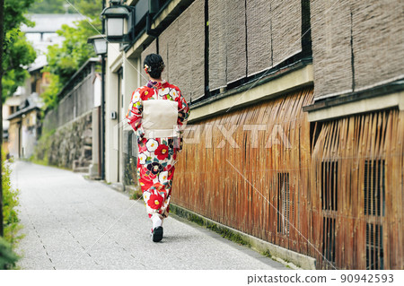 A young woman walking around Kyoto in a kimono A young woman walking around Kyoto in a kimono 90942593
