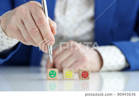 Emotion face symbol on wooden cube blocks 90943636