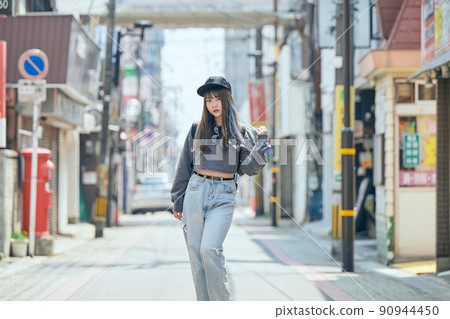 Gen Z women standing looking at the camera 90944450