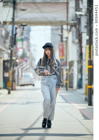 Gen Z women standing looking at the camera 90944451