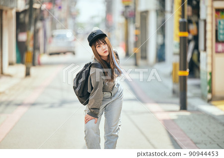Gen Z women standing looking at the camera 90944453