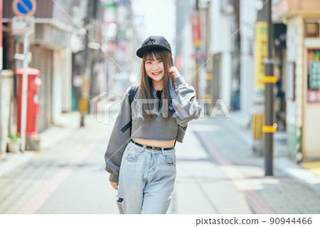 Gen Z women standing looking at the camera 90944466
