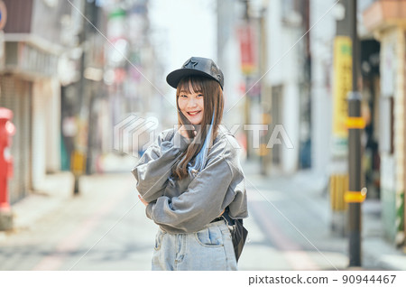 Gen Z women standing looking at the camera 90944467